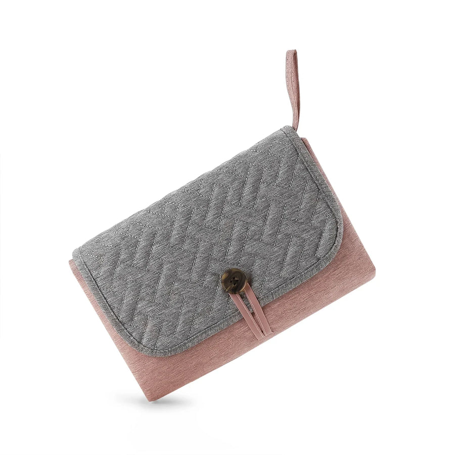 Cambiador portátil gris con rosa